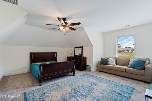 bedroom featuring ceiling fan, vaulted ceiling, and light colored carpet