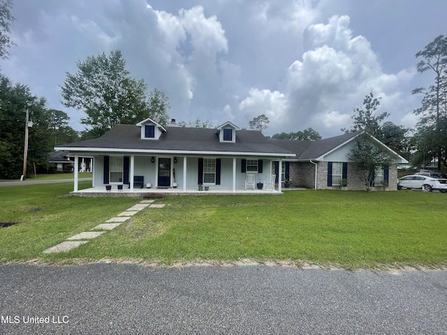 6530 Koula Dr, Diamondhead, MS 39525 - view of front of property featuring covered porch and a front lawn