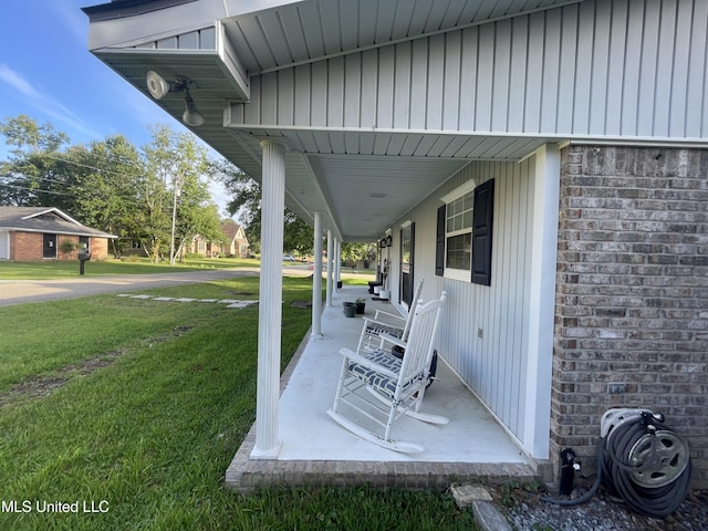 6530 Koula Dr, Diamondhead, MS 39525 - covered porch featuring a yard