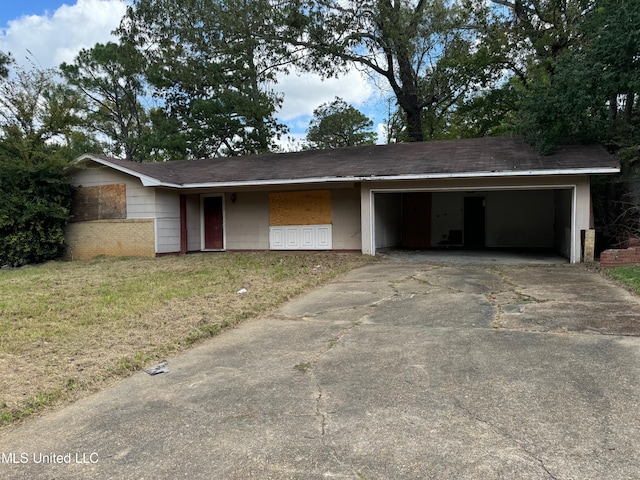 ranch-style home featuring a carport and a front yard