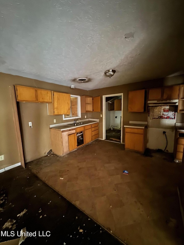 kitchen featuring a textured ceiling