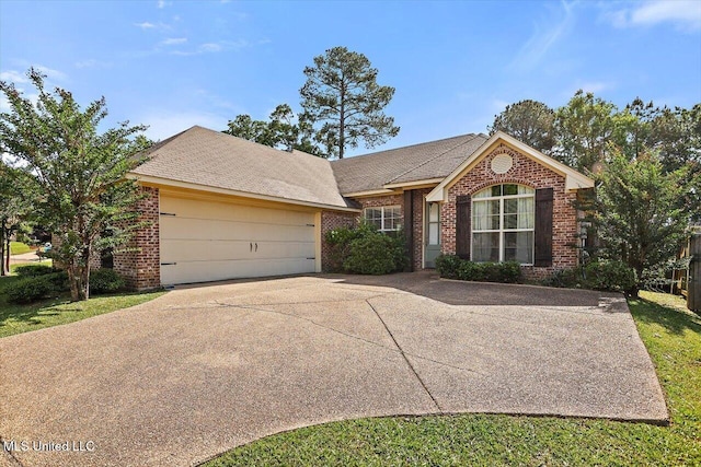 single story home featuring an attached garage, concrete driveway, and brick siding
