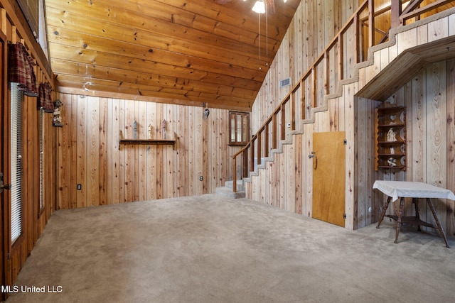 48 Brady Rd, Petal, MS 39465 - below grade area with carpet flooring, stairway, wood walls, and wooden ceiling