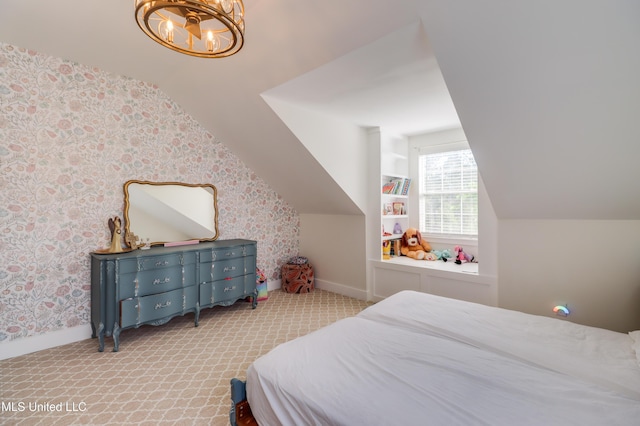 carpeted bedroom with lofted ceiling, a chandelier, baseboards, and wallpapered walls