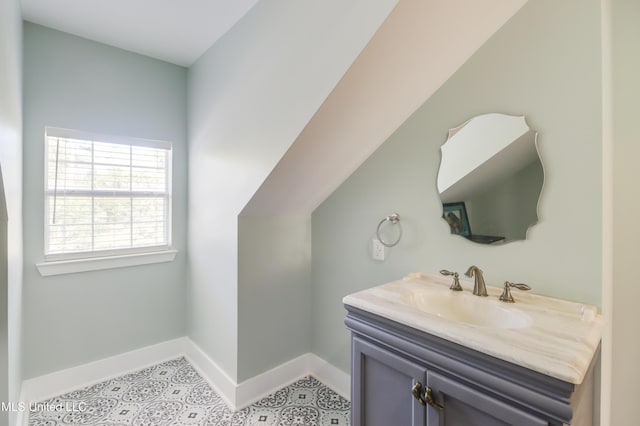 bathroom featuring baseboards and vanity