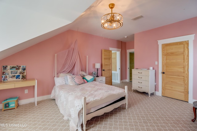 carpeted bedroom featuring a chandelier and baseboards