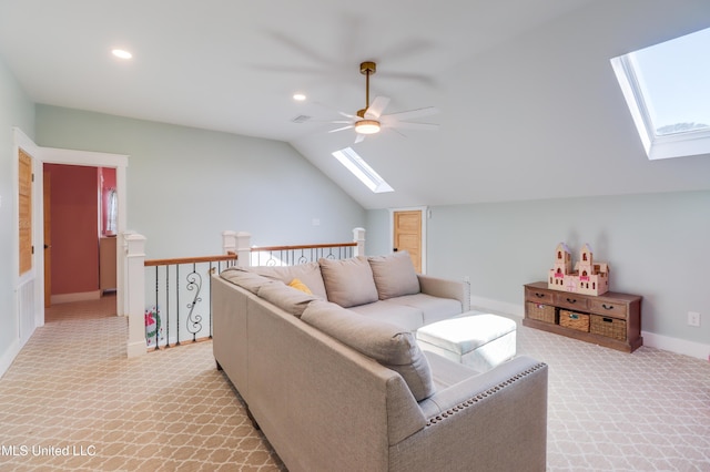 living room with a skylight, ceiling fan, light colored carpet, lofted ceiling, and recessed lighting