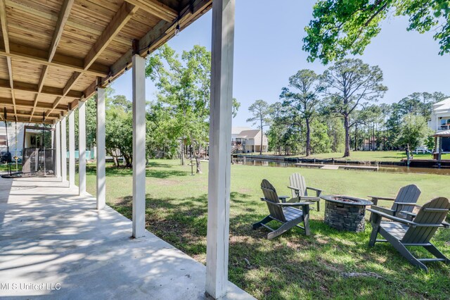 view of patio / terrace with an outdoor fire pit