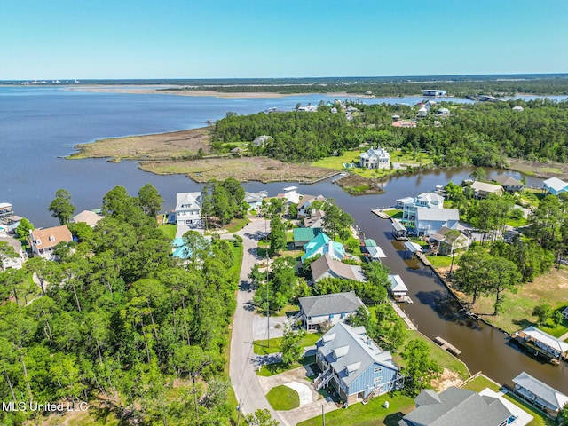 aerial perspective of suburban area featuring a nearby body of water
