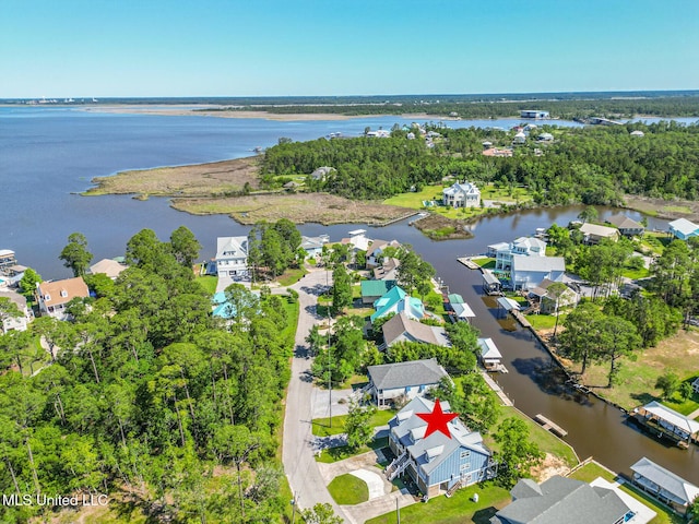 aerial view of residential area with a nearby body of water