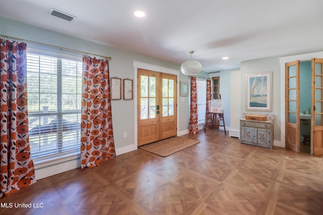 foyer entrance with recessed lighting, baseboards, and french doors