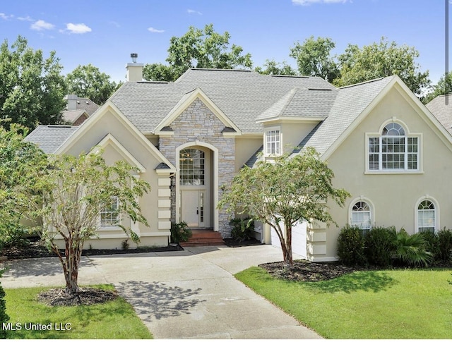 view of front facade with a front yard