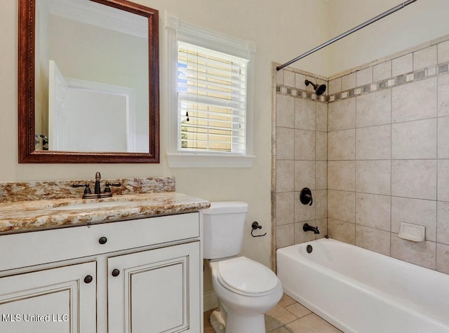 full bathroom with vanity, toilet, tiled shower / bath combo, and tile patterned flooring