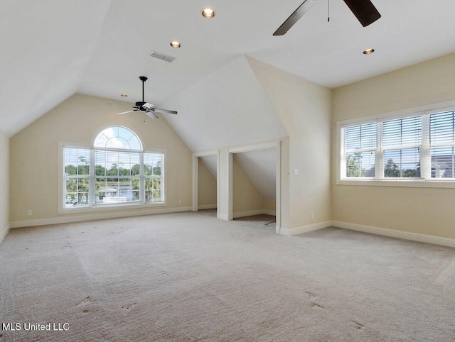 bonus room featuring vaulted ceiling, light carpet, and ceiling fan