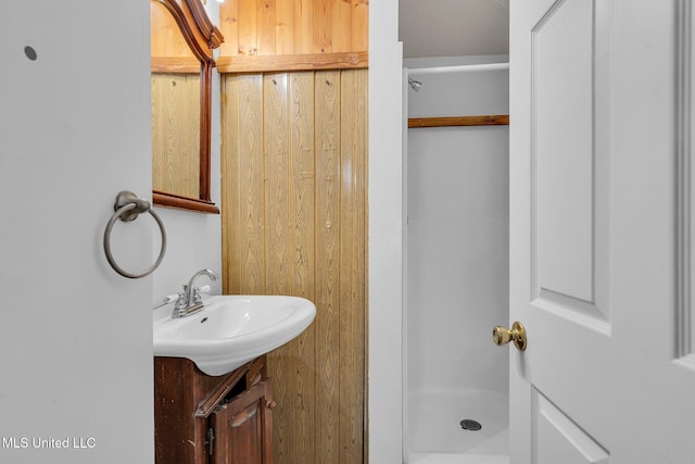 bathroom with a stall shower and vanity