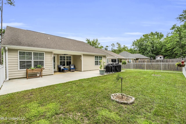 rear view of property featuring a patio