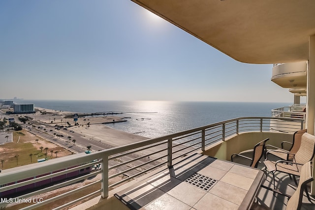 balcony featuring a water view