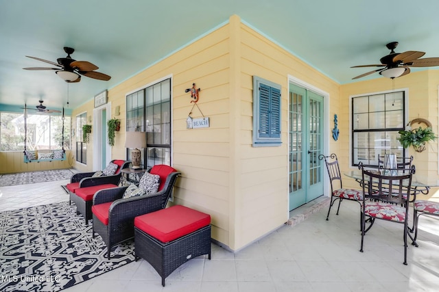 view of patio with french doors and ceiling fan