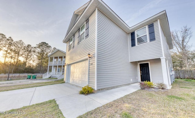 view of front of property featuring driveway and a garage