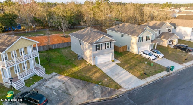 birds eye view of property with a residential view