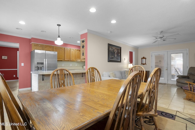 dining area with light tile patterned floors, french doors, recessed lighting, and crown molding