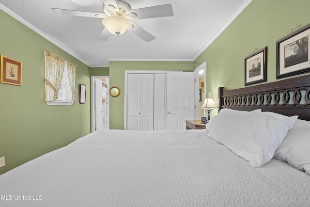 bedroom with a textured ceiling, ceiling fan, a closet, and crown molding