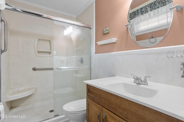 full bath featuring ornamental molding, a stall shower, vanity, and toilet