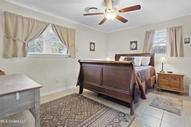 bedroom featuring light tile patterned floors, ornamental molding, a ceiling fan, and baseboards