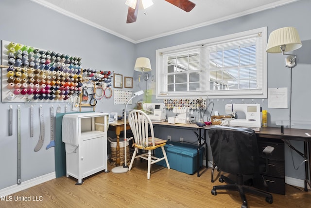 office area featuring ornamental molding, a ceiling fan, and wood finished floors