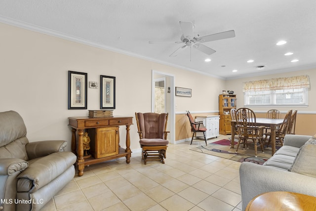 living room with ceiling fan, light tile patterned flooring, and crown molding