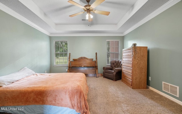 7669 Meadow Ridge Ln, Olive Branch, MS 38654 - bedroom with a tray ceiling, light colored carpet, baseboards, and a ceiling fan