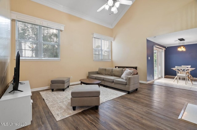 7669 Meadow Ridge Ln, Olive Branch, MS 38654 - living area with ornamental molding, wood finished floors, a ceiling fan, vaulted ceiling, and baseboards