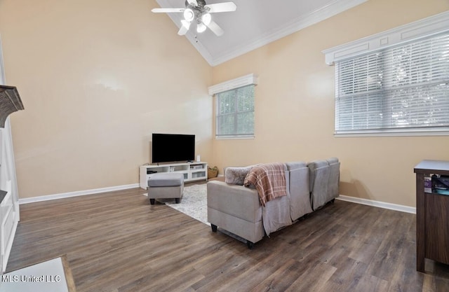 7669 Meadow Ridge Ln, Olive Branch, MS 38654 - living room featuring ornamental molding, a ceiling fan, dark wood-type flooring, vaulted ceiling, and baseboards