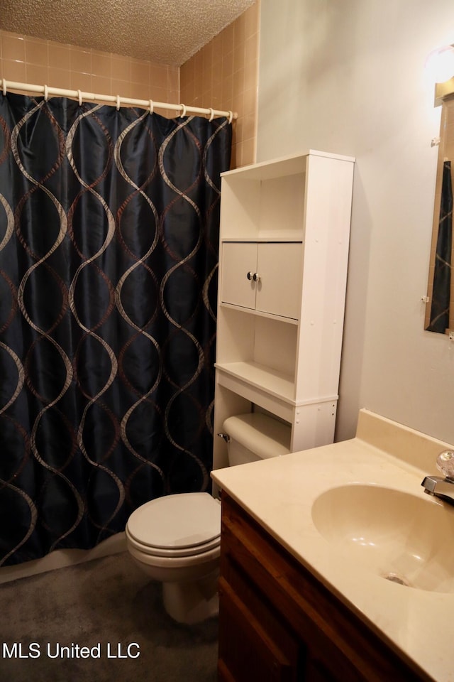 2440 E Church Rd, Southaven, MS 38671 - bathroom with vanity, a textured ceiling, and a shower with shower curtain