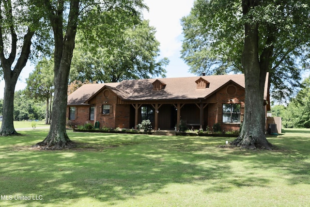 2440 E Church Rd, Southaven, MS 38671 - view of front facade with brick siding, a front yard, and a porch