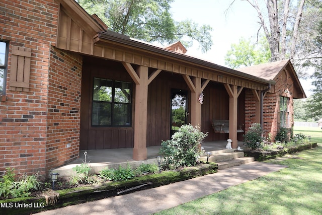2440 E Church Rd, Southaven, MS 38671 - property entrance with a porch and brick siding