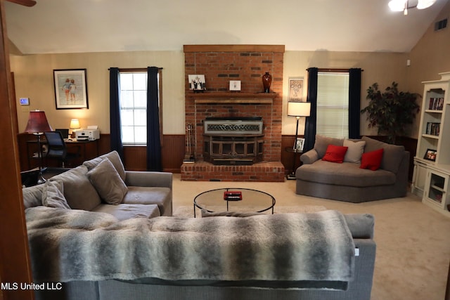 2440 E Church Rd, Southaven, MS 38671 - carpeted living area featuring vaulted ceiling, an office area, a fireplace, ceiling fan, and wainscoting