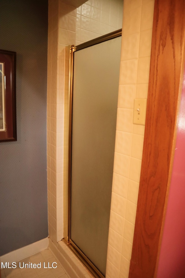 2440 E Church Rd, Southaven, MS 38671 - bathroom featuring a stall shower and tile patterned flooring