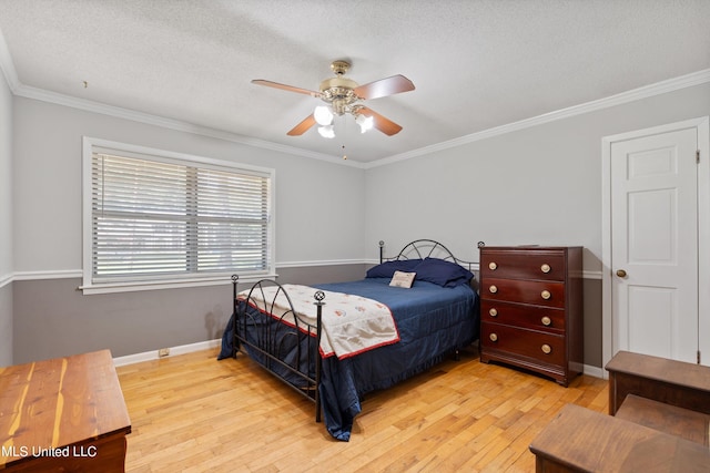 bedroom with light hardwood / wood-style floors, ornamental molding, a textured ceiling, and ceiling fan