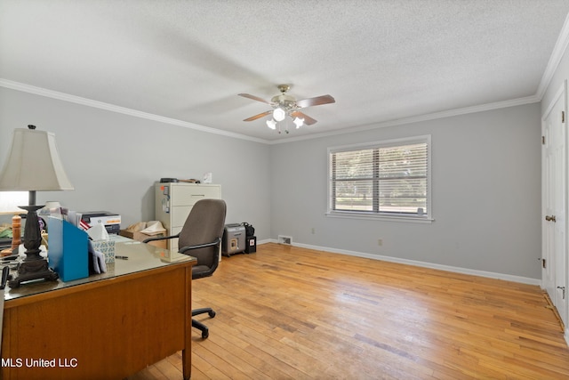 office area with ceiling fan, ornamental molding, a textured ceiling, and light wood-type flooring