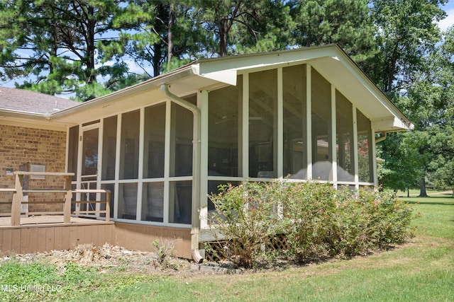 view of property exterior featuring a sunroom