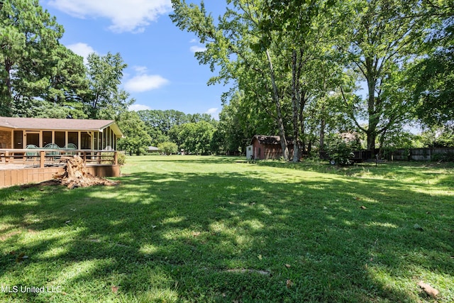 view of yard with a wooden deck