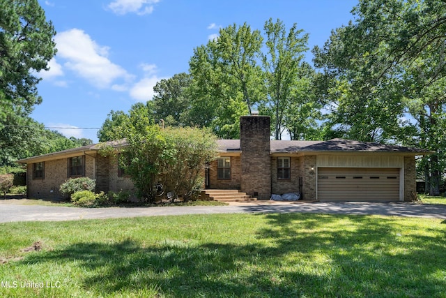 ranch-style home with a front yard and a garage