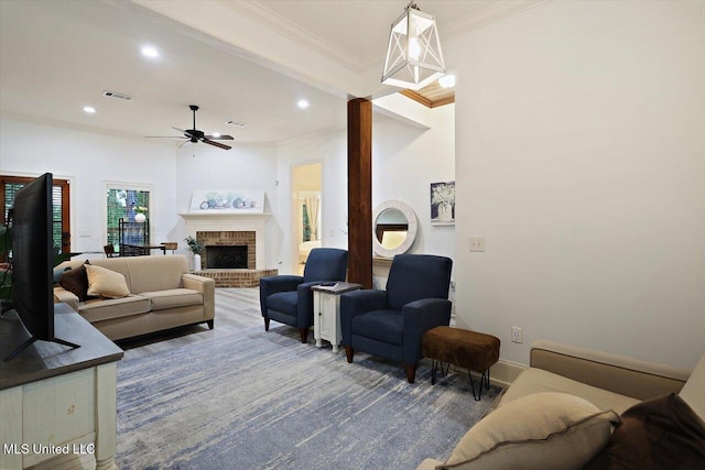 131 Stillhouse Creek Dr, Madison, MS 39110 - living room featuring crown molding, ceiling fan, recessed lighting, a brick fireplace, and baseboards