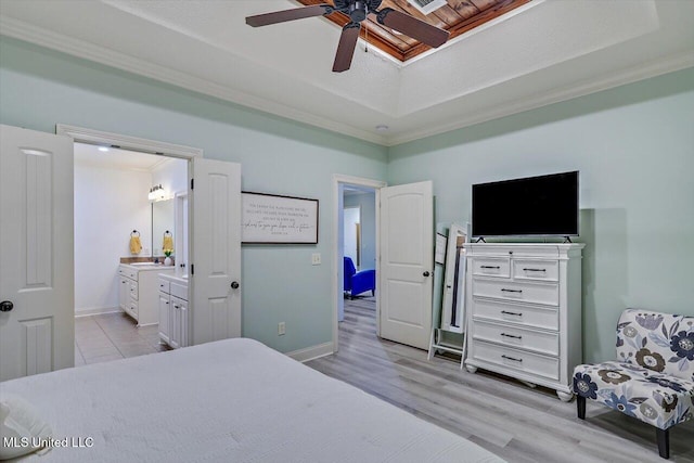 131 Stillhouse Creek Dr, Madison, MS 39110 - bedroom featuring a tray ceiling, ornamental molding, light wood-style flooring, ensuite bath, and baseboards