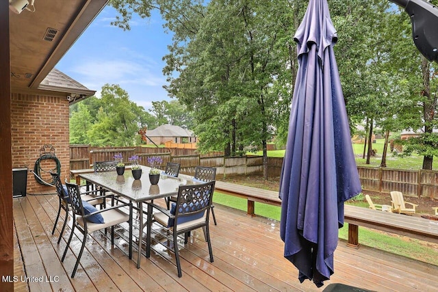 131 Stillhouse Creek Dr, Madison, MS 39110 - wooden deck with a fenced backyard and outdoor dining area