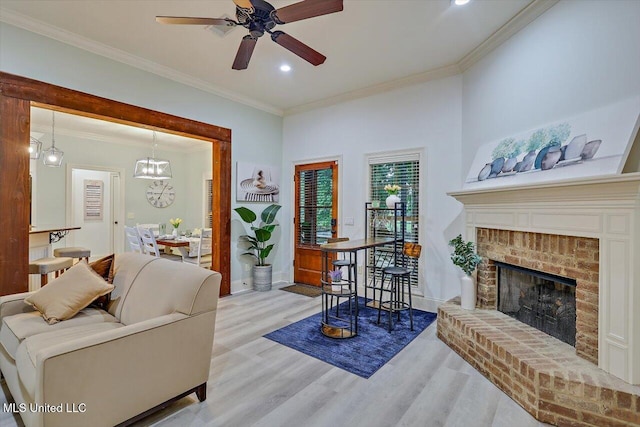 131 Stillhouse Creek Dr, Madison, MS 39110 - living room featuring wood finished floors, ornamental molding, a ceiling fan, a fireplace, and recessed lighting
