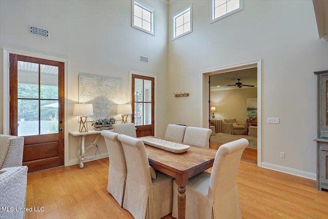 210 Planters Grv, Brandon, MS 39047 - dining area featuring a high ceiling, light wood finished floors, baseboards, and ceiling fan