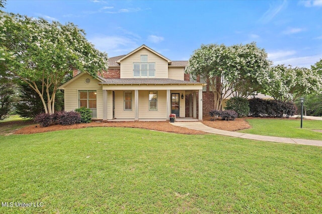 210 Planters Grv, Brandon, MS 39047 - traditional home featuring covered porch, a front yard, roof with shingles, and a chimney