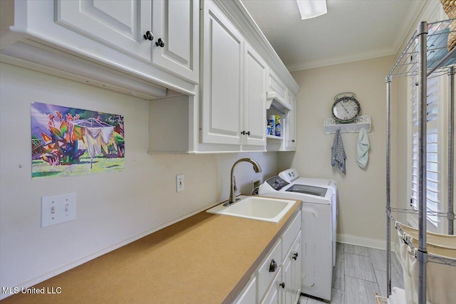 210 Planters Grv, Brandon, MS 39047 - washroom featuring washing machine and dryer, cabinet space, crown molding, and baseboards